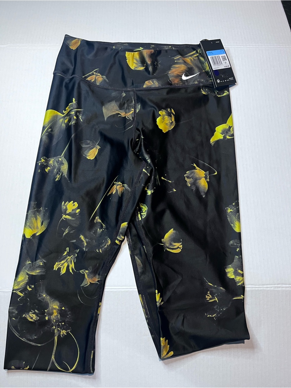 Nike women’s Black Leggings with Yellow Floral Print M size.  Brand NEW